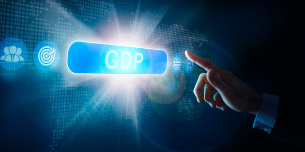A businessman"s hand selecting a GDP business word concept