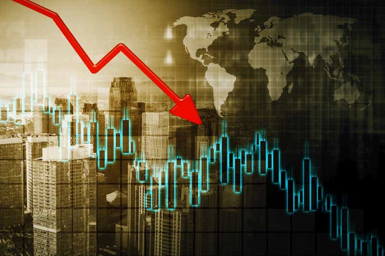 Declining arrow and candlestick with world map