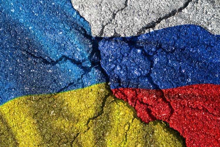 Ukraine and Russia flag with cracks, political conflict.