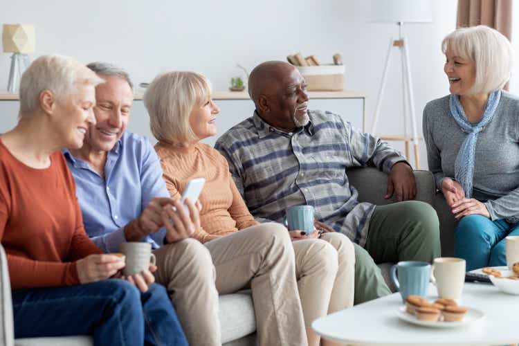 International group of cheerful elderly people chilling together