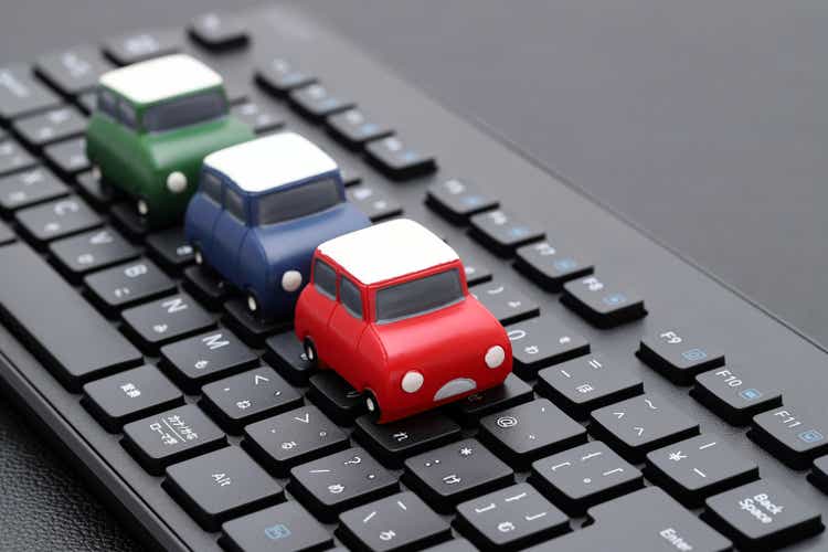 toy car on computer keyboard