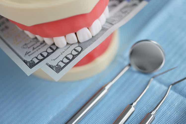 Artificial teeth in fake dentures. Dentist instruments for healthcare