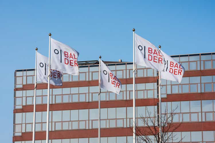 Balder flags outside an office building..