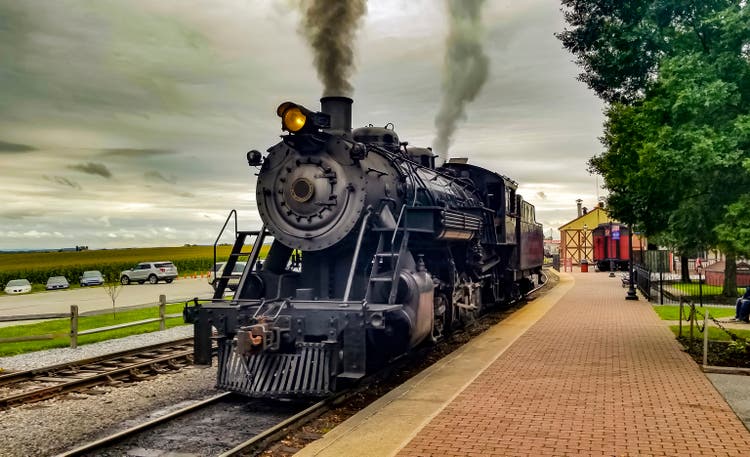 Restored Steam Engine Getting Ready for Service, Blowing Smoke and Steam