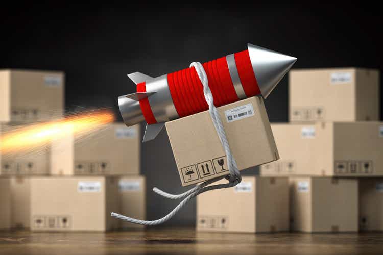 Fast delivery packet or parcel concept. Rocket with cardpoard box.