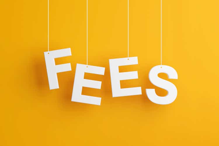 The word fees levitates on yellow background.