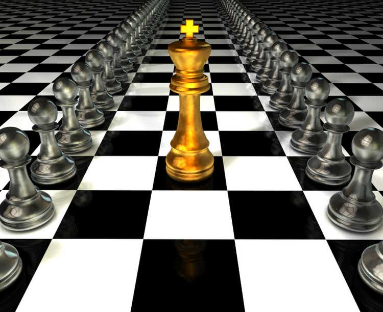 The King in battle chess game stand on chessboard with black isolated background. Concept business strategy, planning and decision.