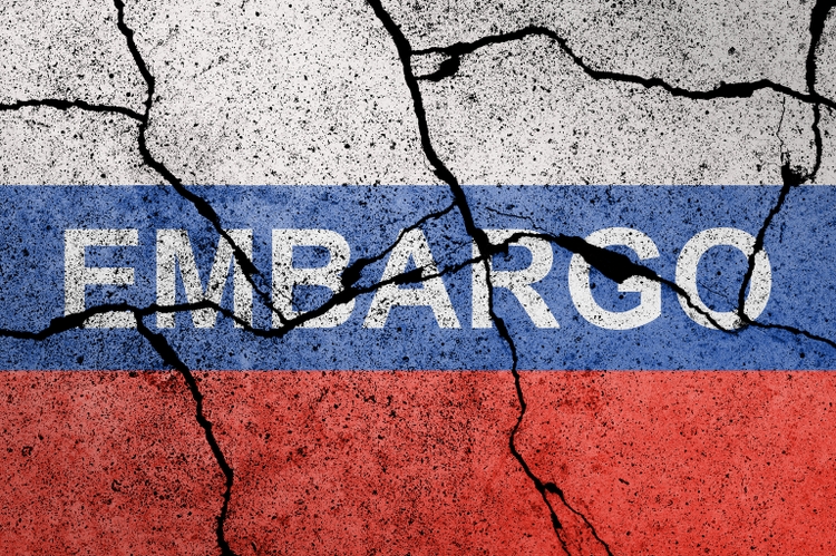 Flag of Russia painted on a concrete wall with word EMBARGO