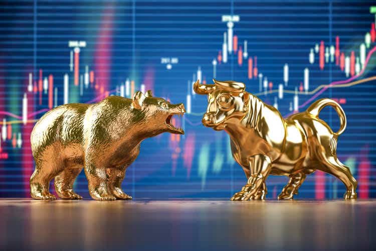 Gold bull and bear on stock data chart background.  Investment market, financial stock market and bear concept.