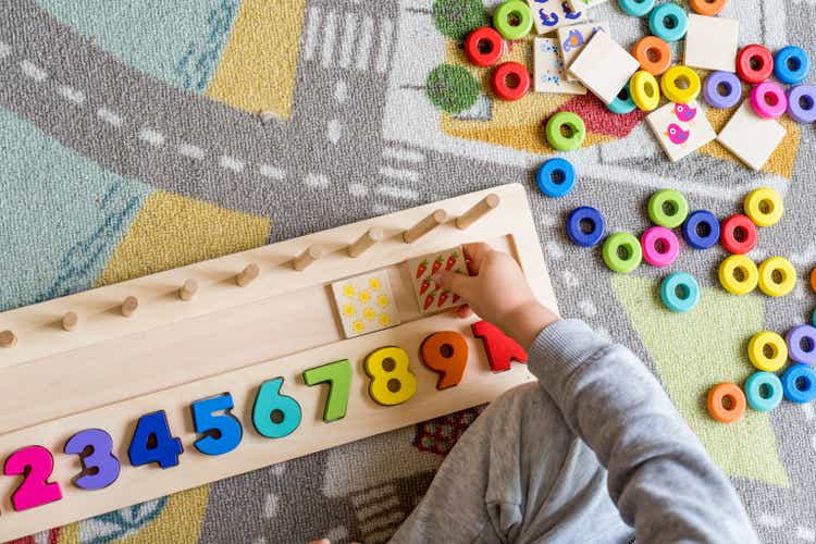 Baby toddler early development. Wooden stack and count rainbow colors learning game. Child learn colors and numbers