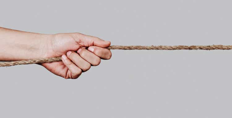 man pulling a rope, web banner format