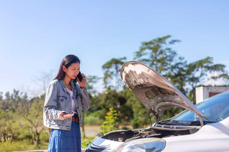 Desperate woman calling emergency help smartphone.