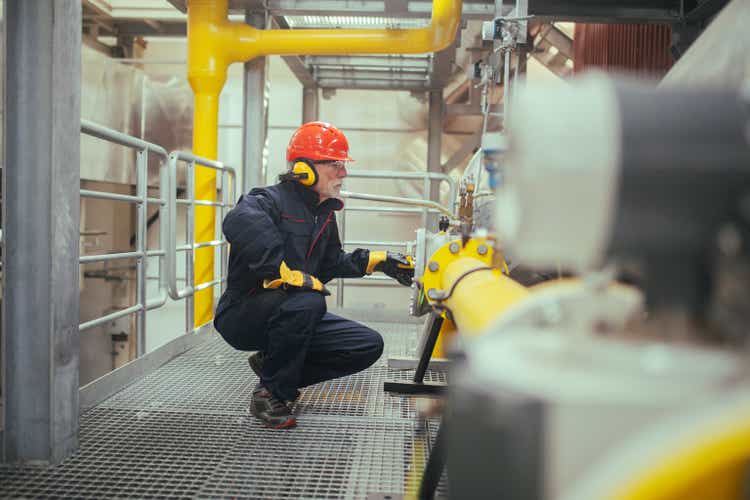 Industrial worker working in industry plant.