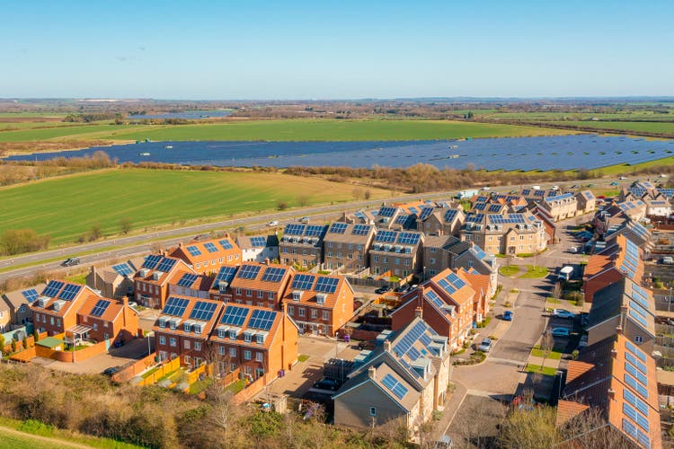 Drone view of a new housing development with solar panels - sustainable living