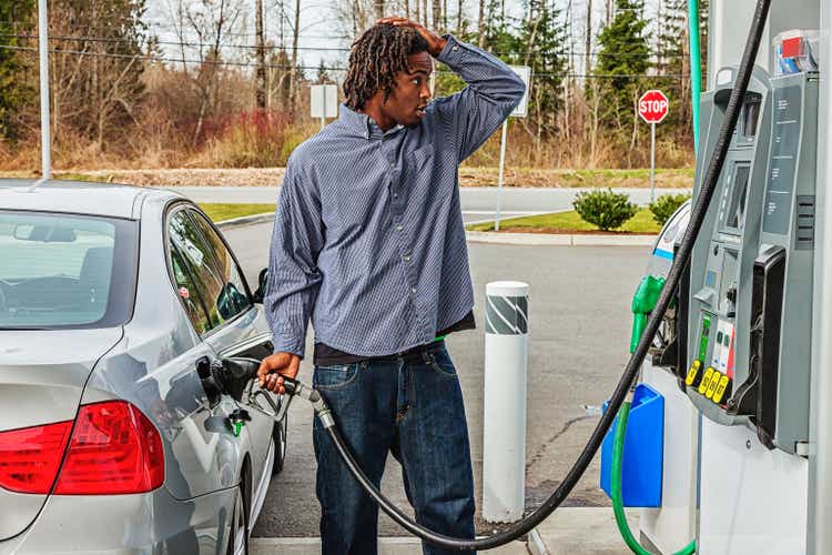 Young Man at Gas Station in Shock Over Sale Price