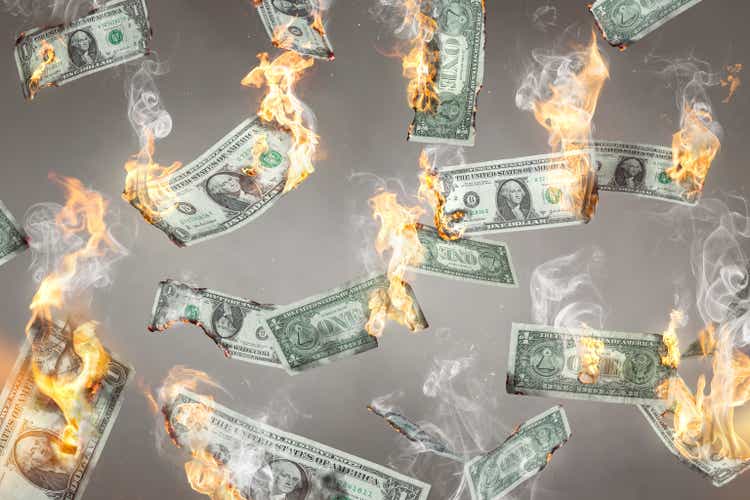 Burning US Dollar notes