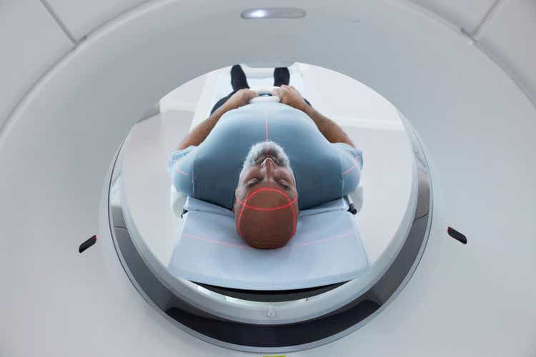 Mature patient in medical x-ray scanner