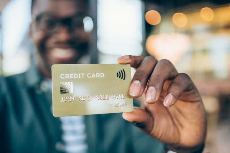 Man holding a credit card.