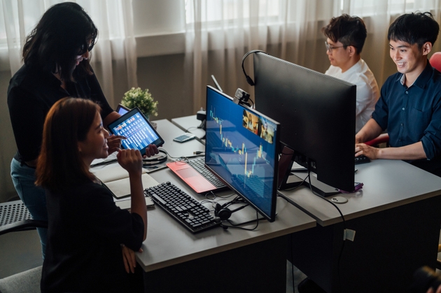 Business people working together online with computer at office