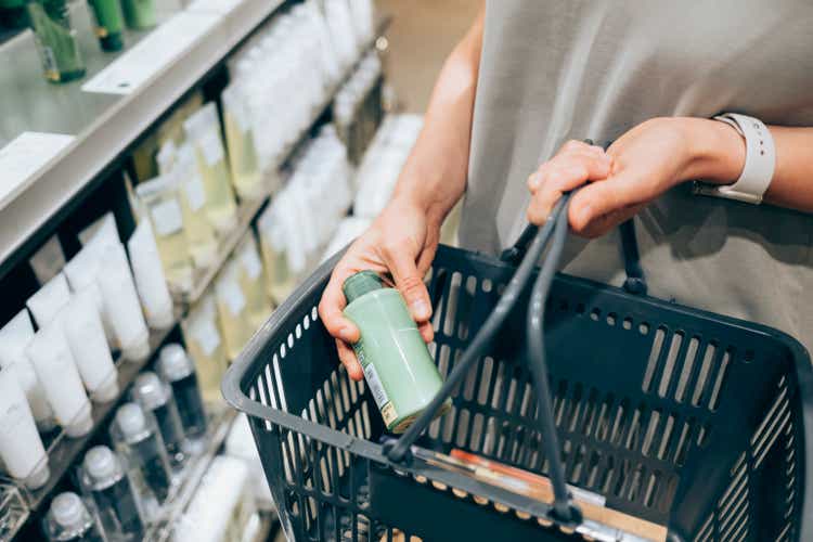 An Unrecognizable Caucasian Woman Buying Some Cosmetic Products