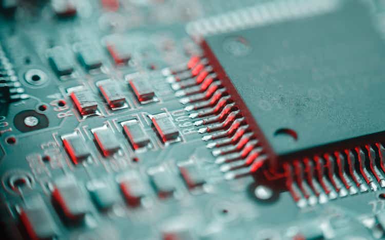 Computer Microchips and Processors on Electronic circuit board. Computer hardware technology. Abstract technology microelectronics concept background. Macro shot, shallow focus.