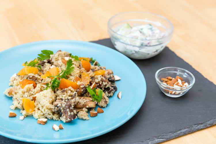 Apricot couscous with Ras-el-Hanout mushrooms, almonds and cucumber yogurt dip"n