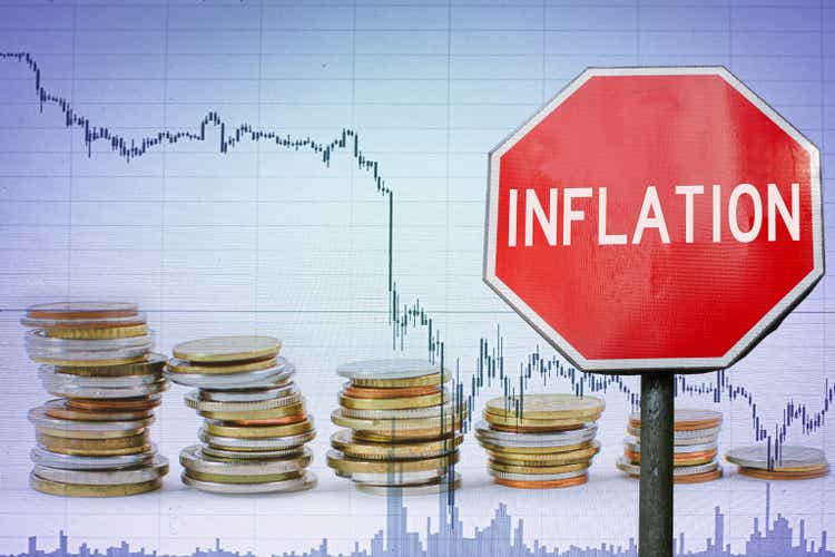 Inflation sign on economy background - graph and coins.