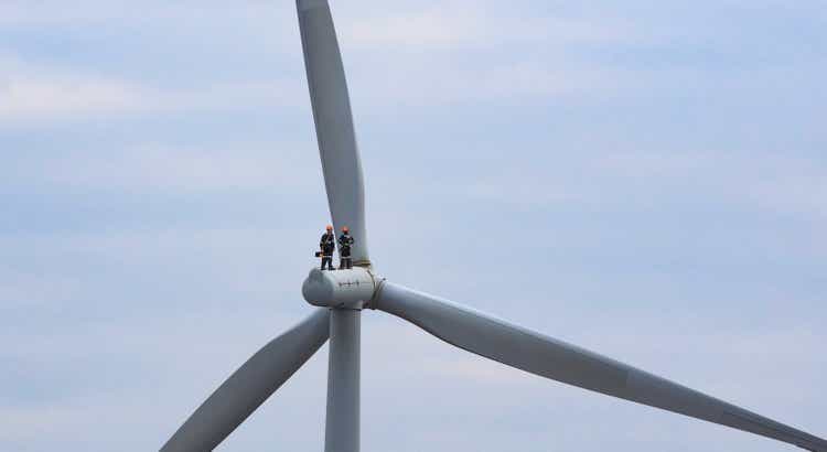Professional maintenance team working on Wind Turbine , Green and Renewable Energy concept
