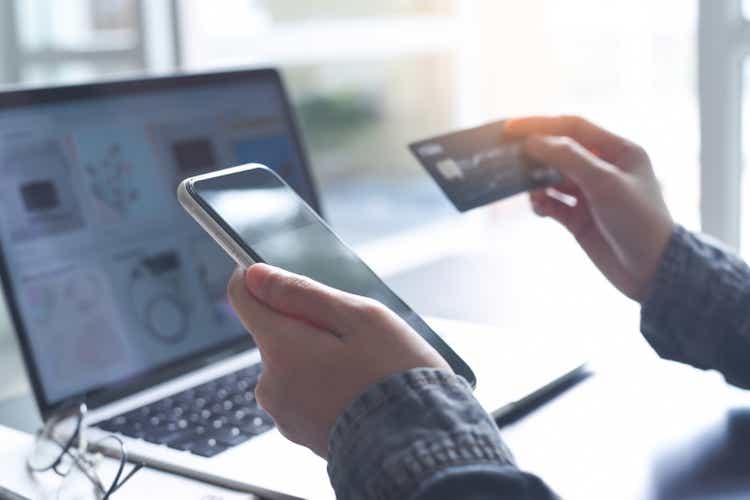 Online Shopping on Laptop and mobile banking, using credit card via mobile phone, digital marketing, E-commerce concept