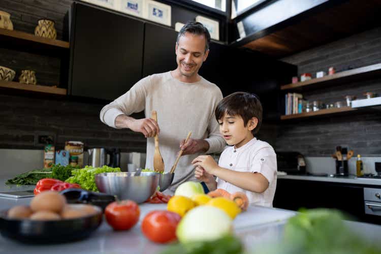 Cook together with your father in the kitchen at home