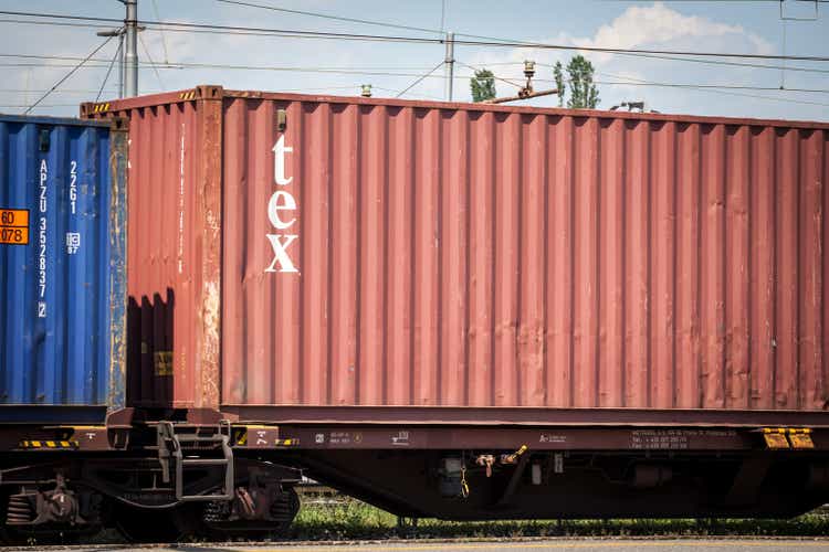 Logo of Textainer group holdings on a container on a freight train. Tex container, or textainer is a bermuda container leaser and reseller.