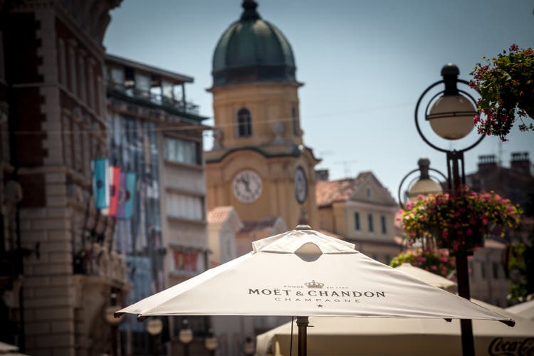 Selective blur on a bar umbrella with the logo of Moet & Chandon. Moet et Chandon is a French brand of luxury champaign champagne part of Moet Hennessy.