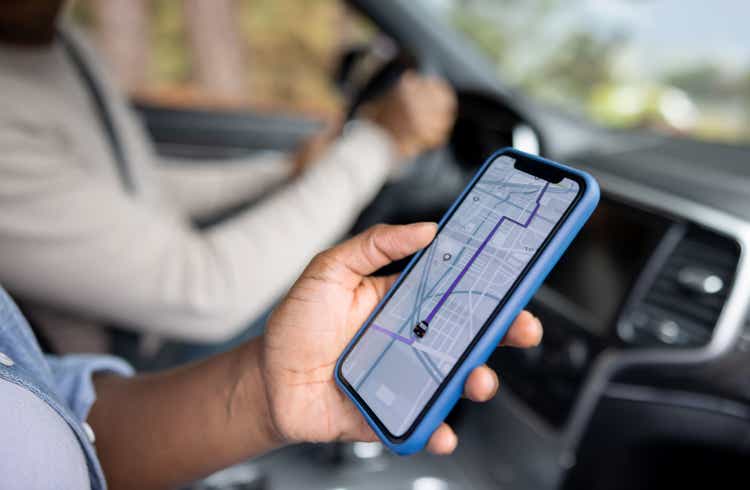 Close-up of a couple using GPS while driving a car