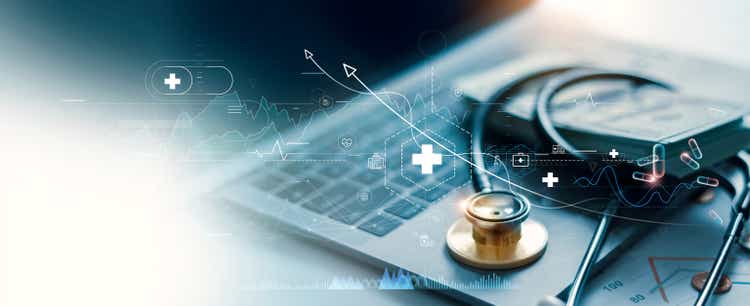 Healthcare business graph and medical business growth data and doctor's golden stethoscope on laptop, investment, finance and banking, medical business report on global network.