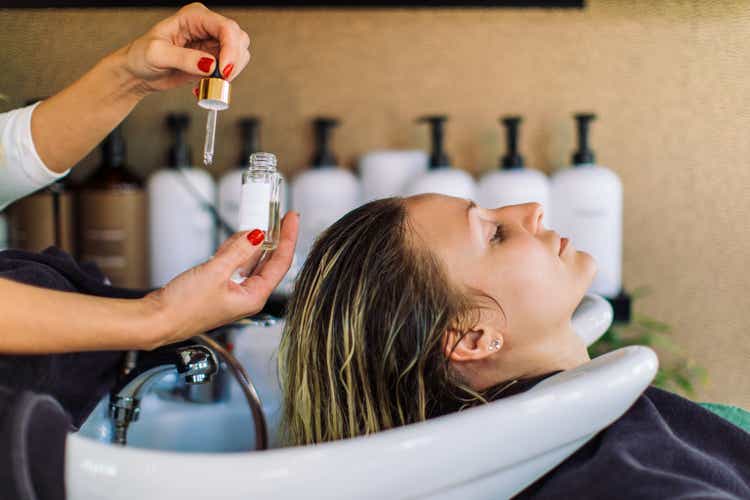 Woman getting her hair washed in hair salon
