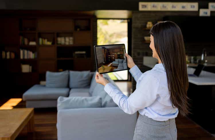 Real estate agent making a virtual showing of a house for sale
