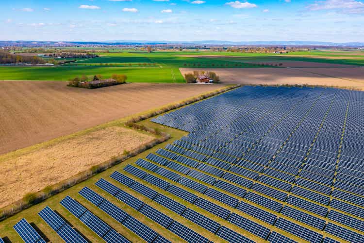 Aerial position of a star parkland pinch galore photovoltaic panels adjacent to cultivation fields successful agrarian Germany