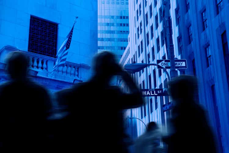 People on busy Wall street in Manhattan