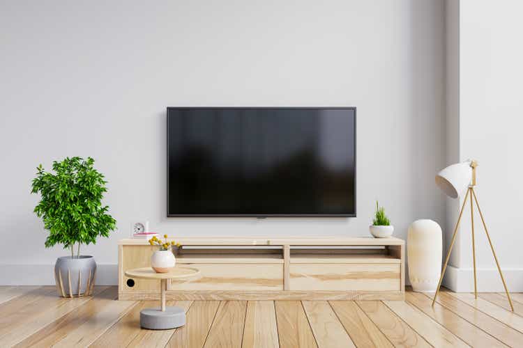 LED TV on the cabinet in modern living room on white wall background.