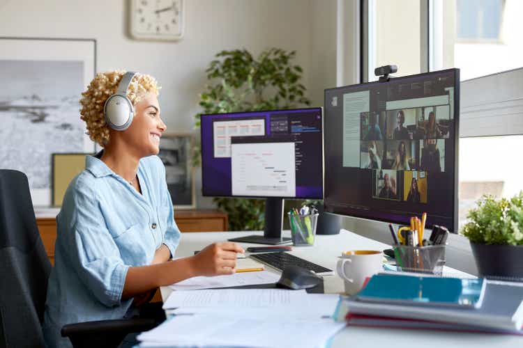 Happy Businesswoman on Video Call With Colleagues