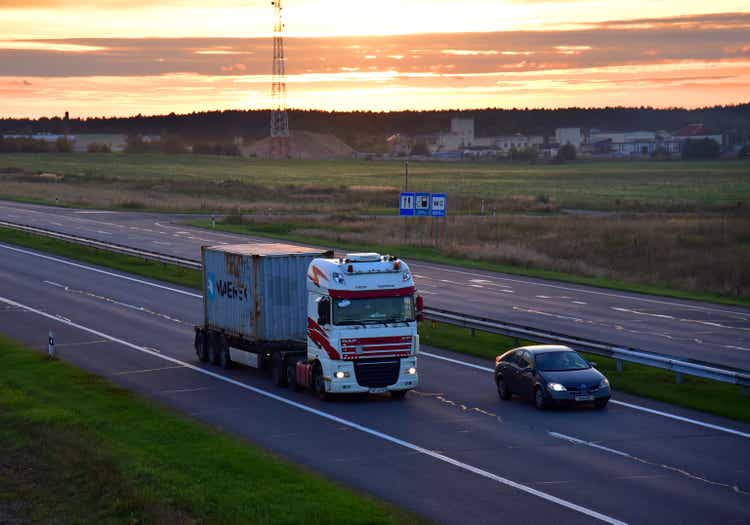 Semi Truck transport the Shipping container by MAERSK on highway.