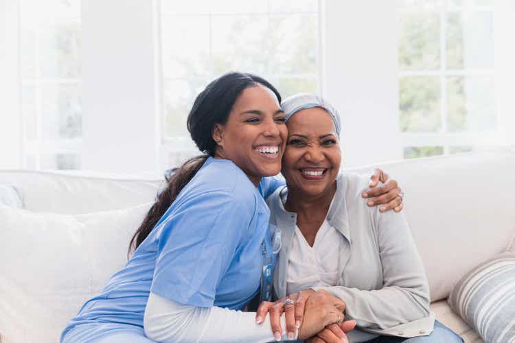 Elderly woman enjoys her nurse