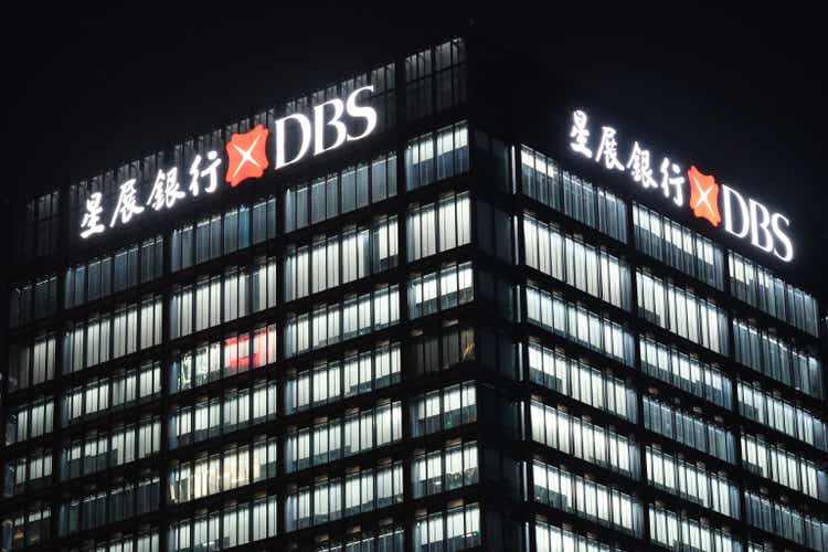 exterior of DBS Bank company office building at night