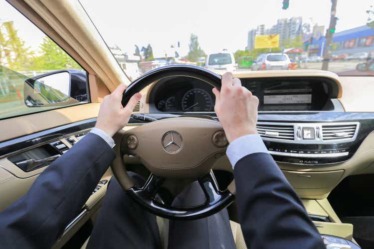 Man driving luxury car Mercedes-Benz S class