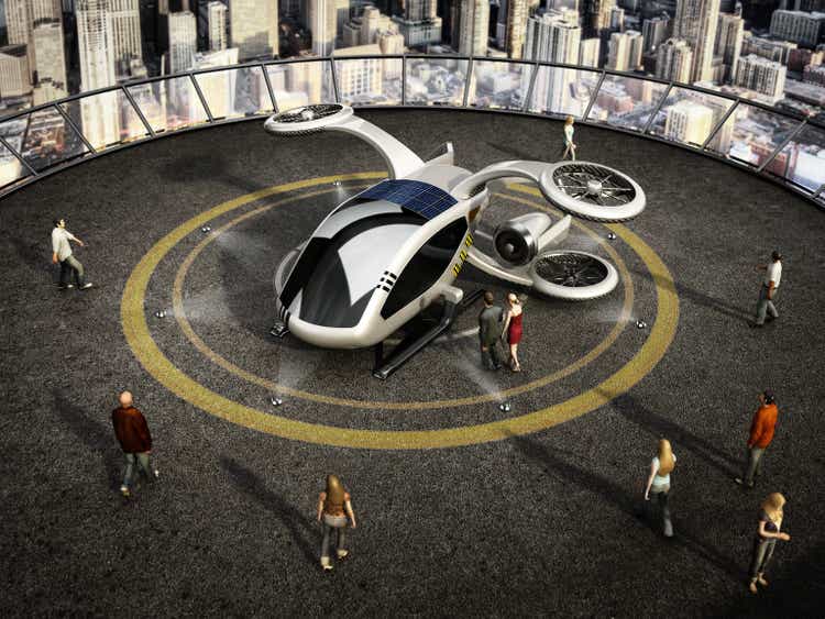 Conceptual eVTOL (electric vertical take-off and landing) aircraft as a taxi/shuttle service at the helipad on top of a building
