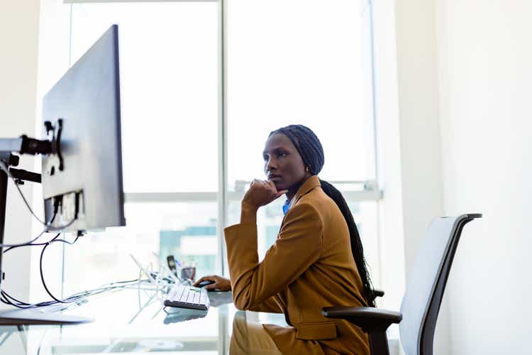 Black female CEO working in her modern luxury office