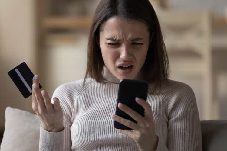 Woman experiences problems while pay bills use cellphone and card
