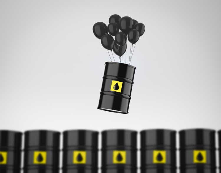 commodity inflation with oil barrel with black balloons floating