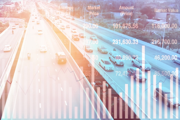 Stock financial index data with graph and chart show successful data investment on transportation and travel industry with blurry aerial view image of traffic for presentation and report background.