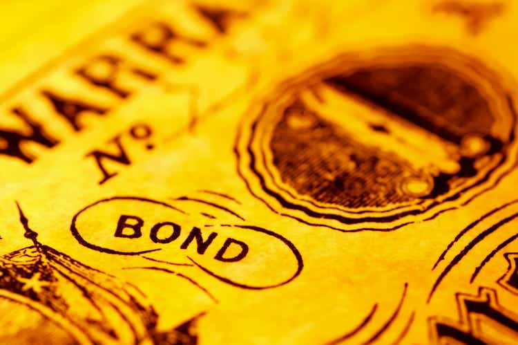 A close-up of the word bond with a yellow tint